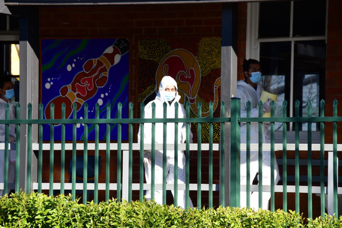 Cleaners at Dubbo West Primary School – the outbreak in the western NSW town keeps growing.