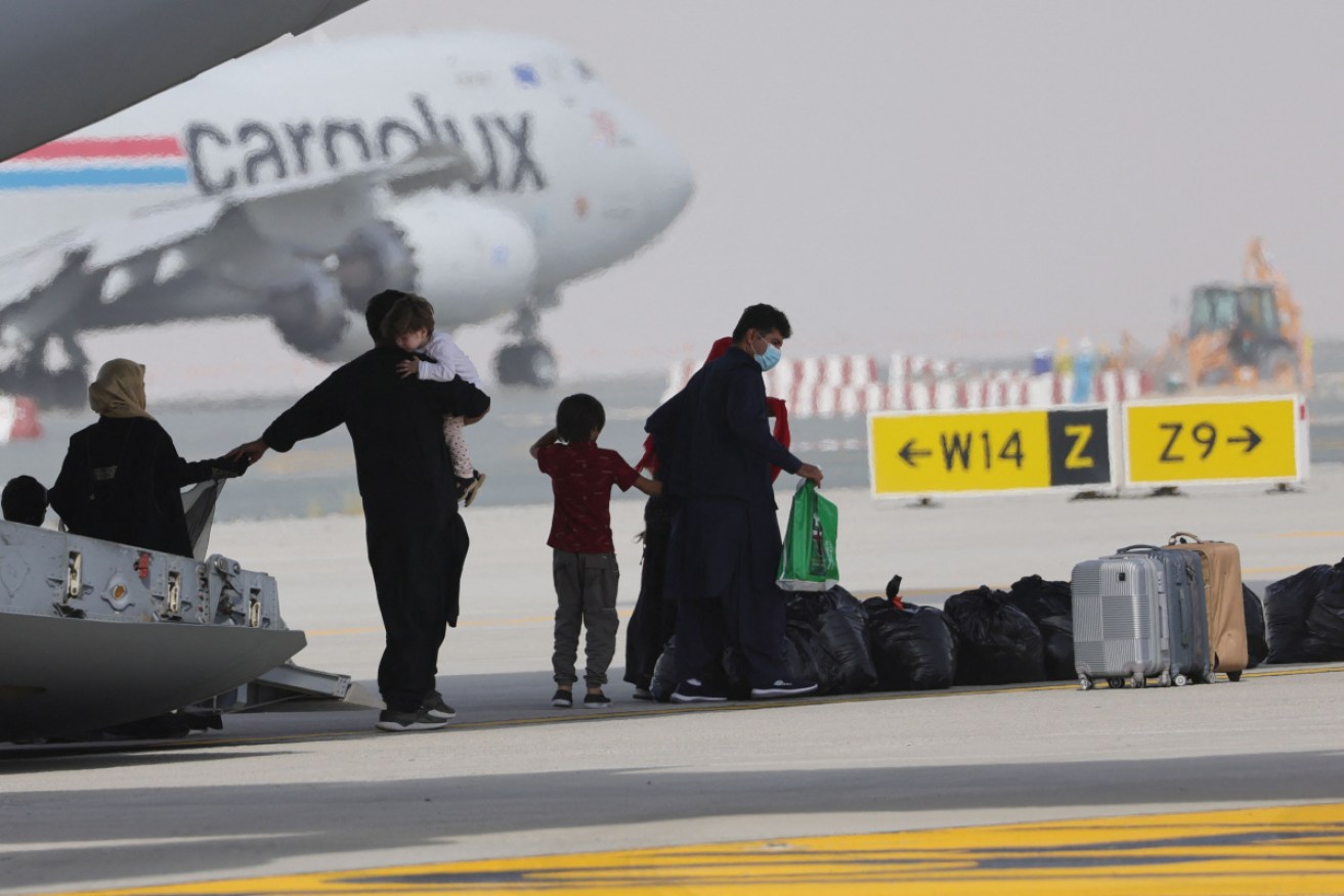 Evacuees from Afghanistan disembark an RAF plane in the UAE.