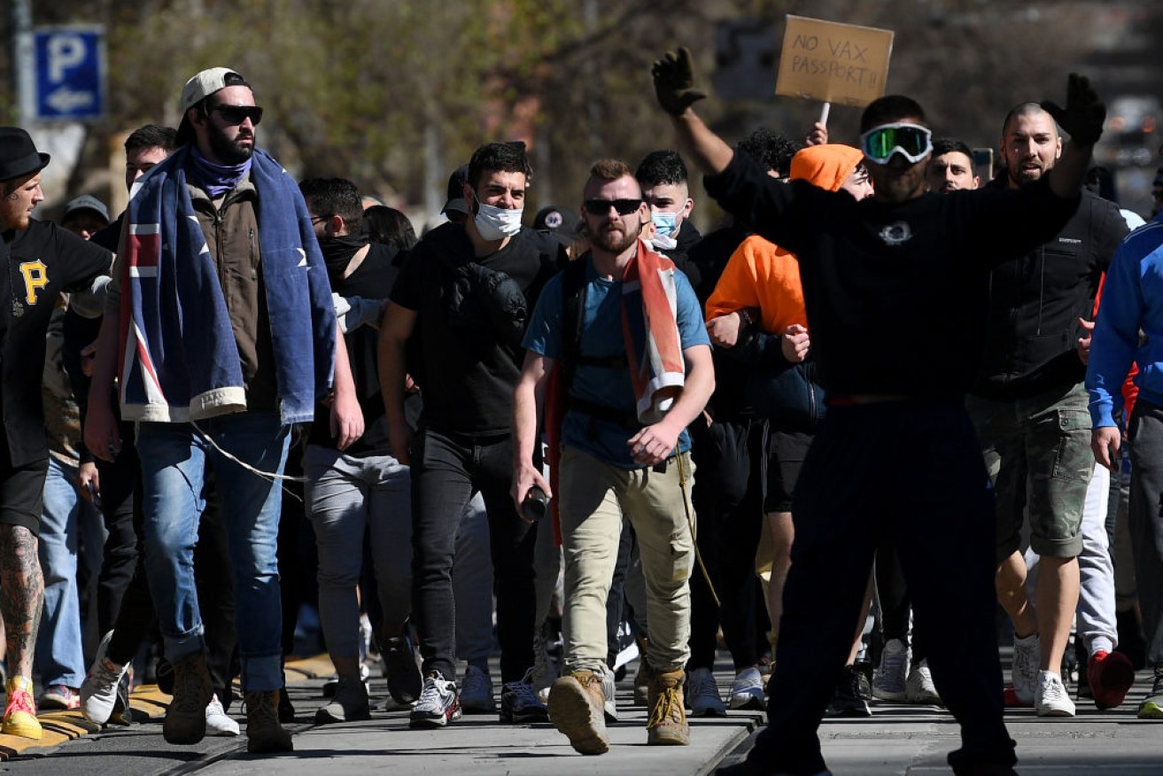 Hundreds of anti-lockdown protesters are being met by police in Melbourne and Brisbane.