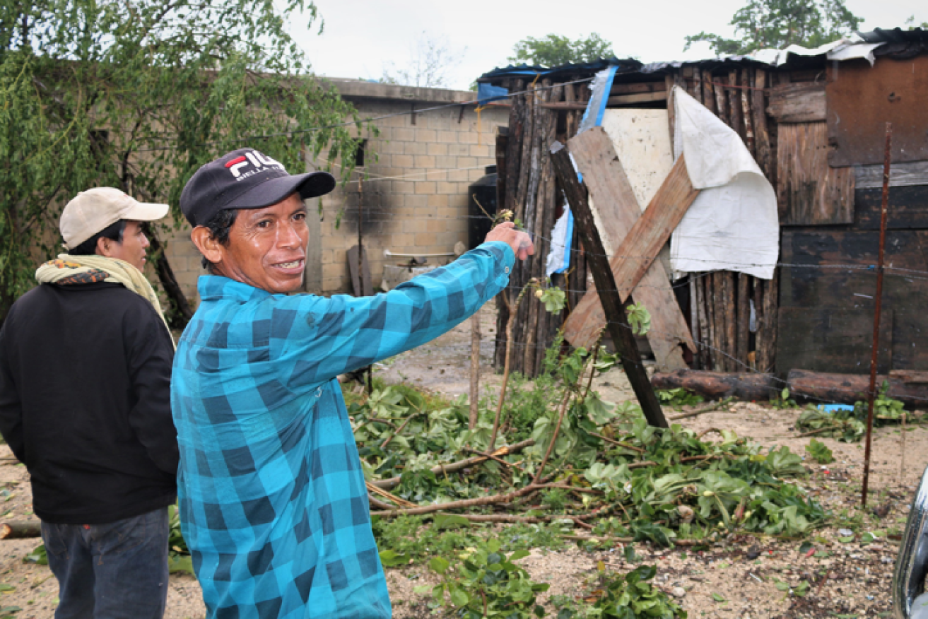 A resident of Tolum points to what is left of his home after Hurricane Grace roared through.