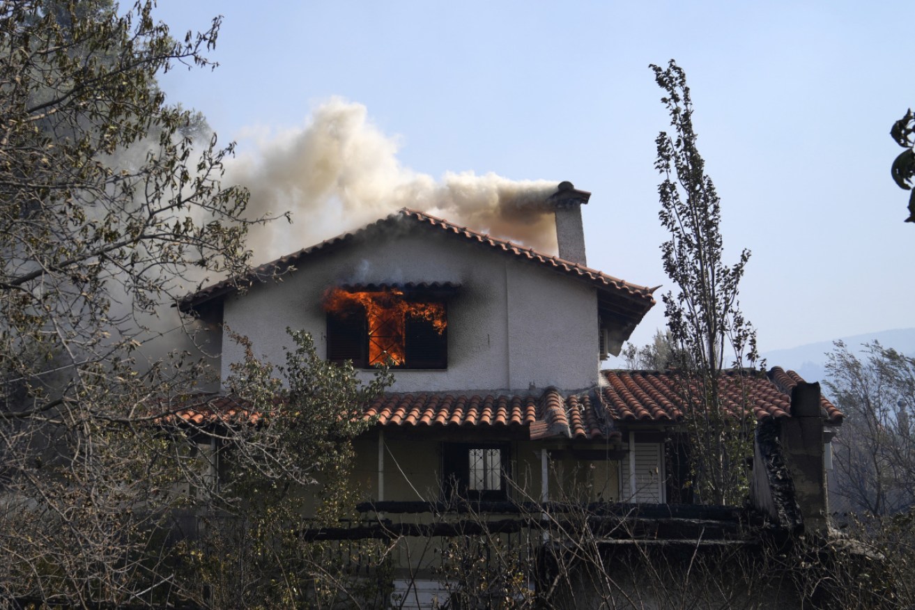 Wildfires have prompted Greece's PM to urge shifts in behaviour to tackle global warming.