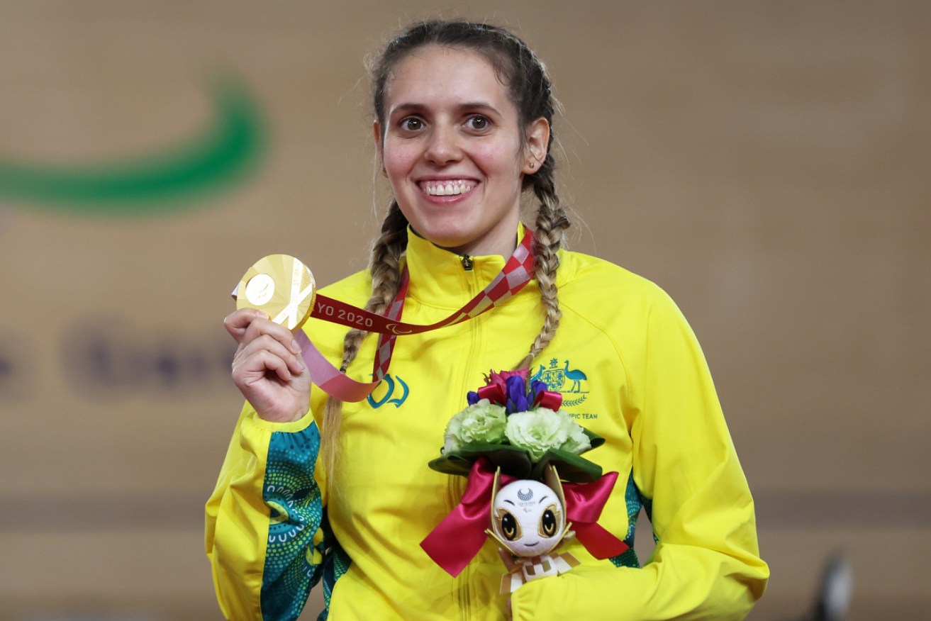 Amanda Reid celebrates her gold medal in Tokyo – one of 13 collected by Australians at the Paralympics so far.