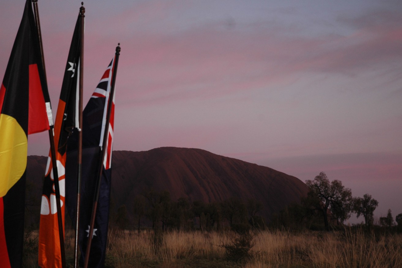 The man had a travel exemption for work but went on a holiday near Uluru.