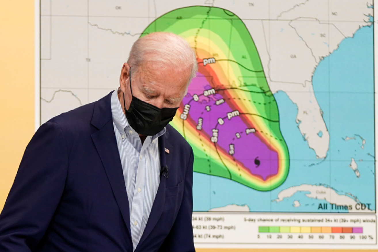 President Biden arrives for a briefing on emergency preparations as Hurricane Ida roars in from the Gulf.