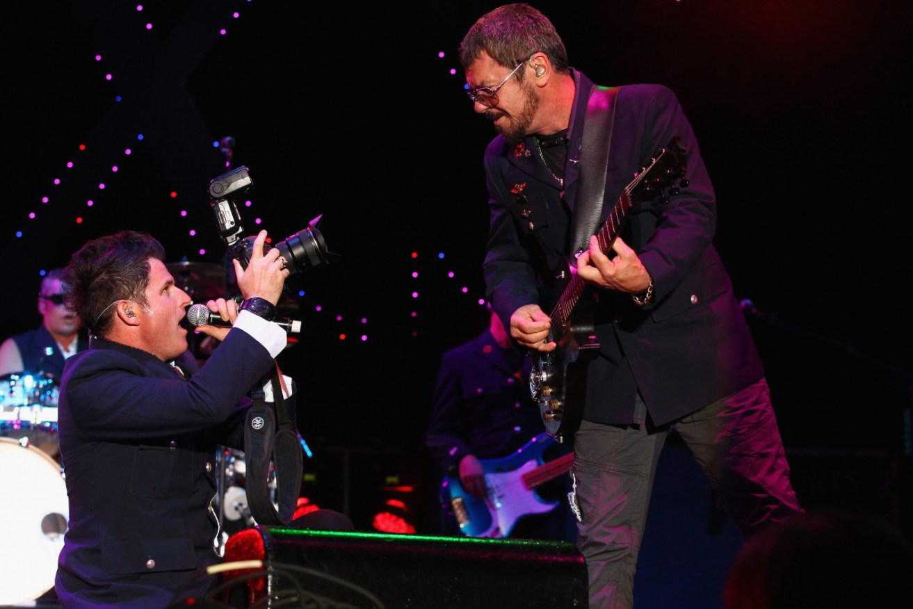 Ciaran Gribbin and Tim Farriss (right) perform in Adelaide in 2012.