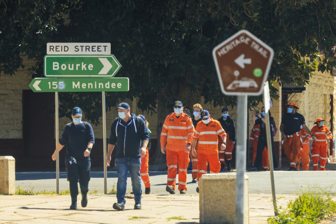 NSW Health staff and SES members in Wilcannia, where more than one in eight of the mostly Indigenous population has tested positive to COVID.