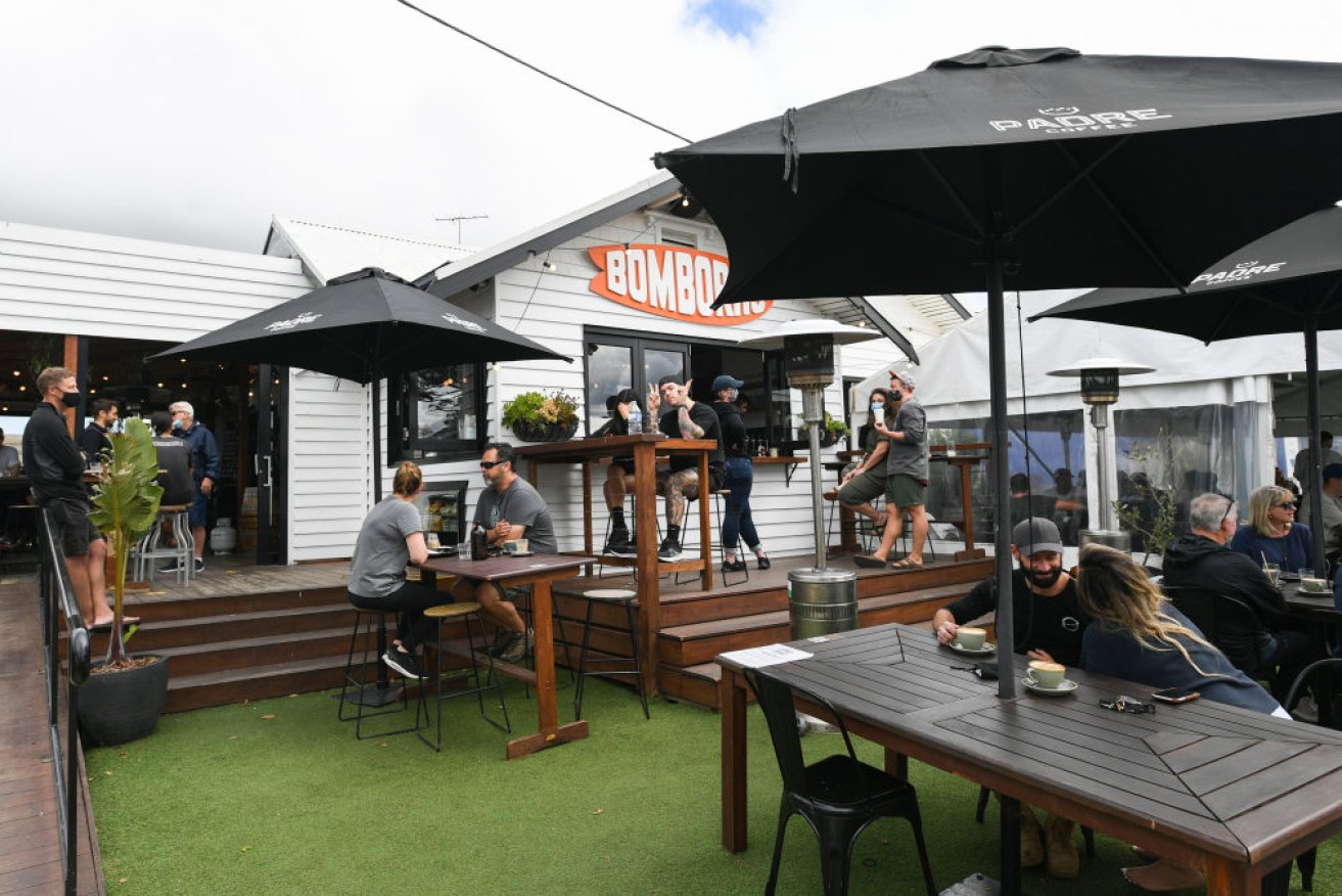 Police have warned they will be looking for Melburnians who try to sneak into regional towns like the popular Surf Coast where cafes are reopening. 