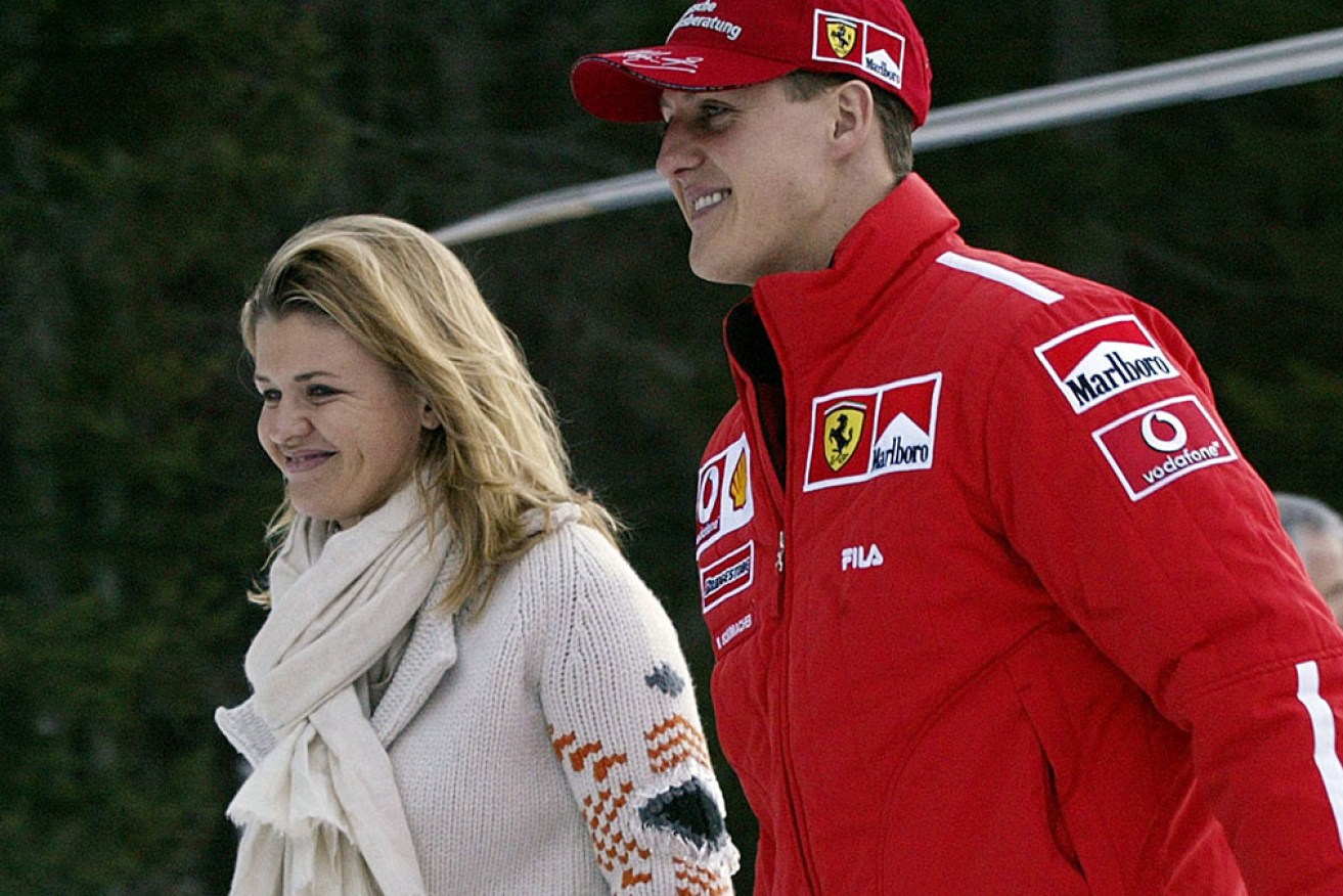 Corinna Schumacher says husband Michael is "different but he's here' after his brain injury in 2013. 