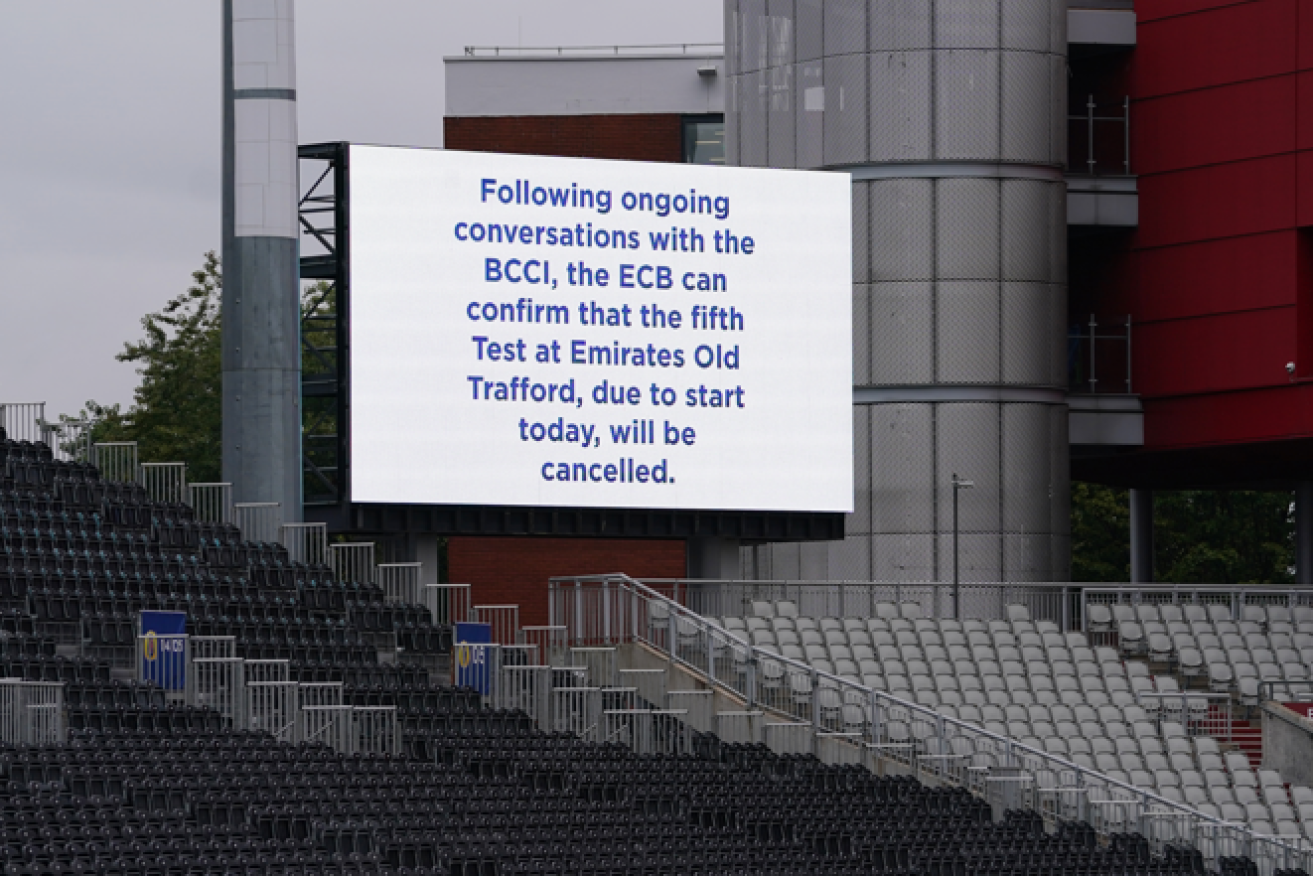 Sign of the times: The scoreboard at Old Trafford relays the grim news that the India Test has been scrapped.