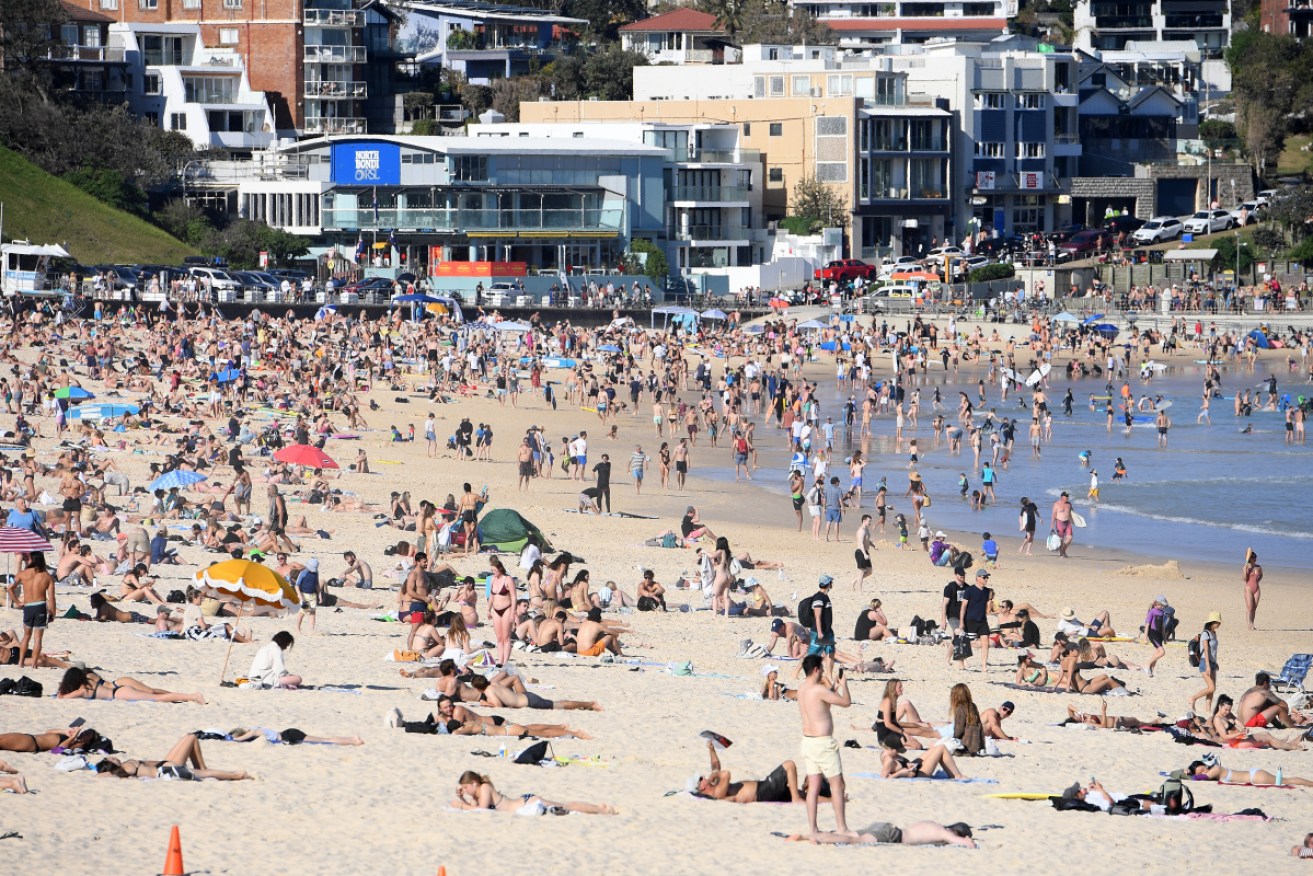 Sydneysiders flock to Bondi beach to make the most of Saturday's warm weather.