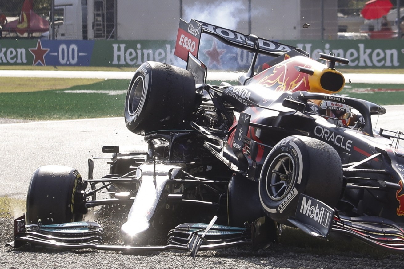 Max Verstappen's Red Bull edged on top of Lewis Hamilton's Mercedes after their Monza collision.