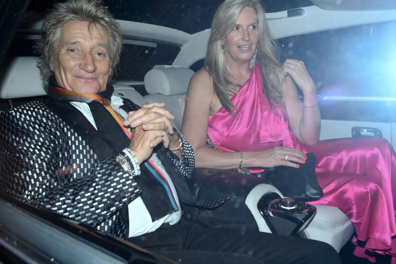 Rock singer Rod Stewart with wife Penny Lancaster. His assault trial has been cancelled and a plea hearing set by a US judge.