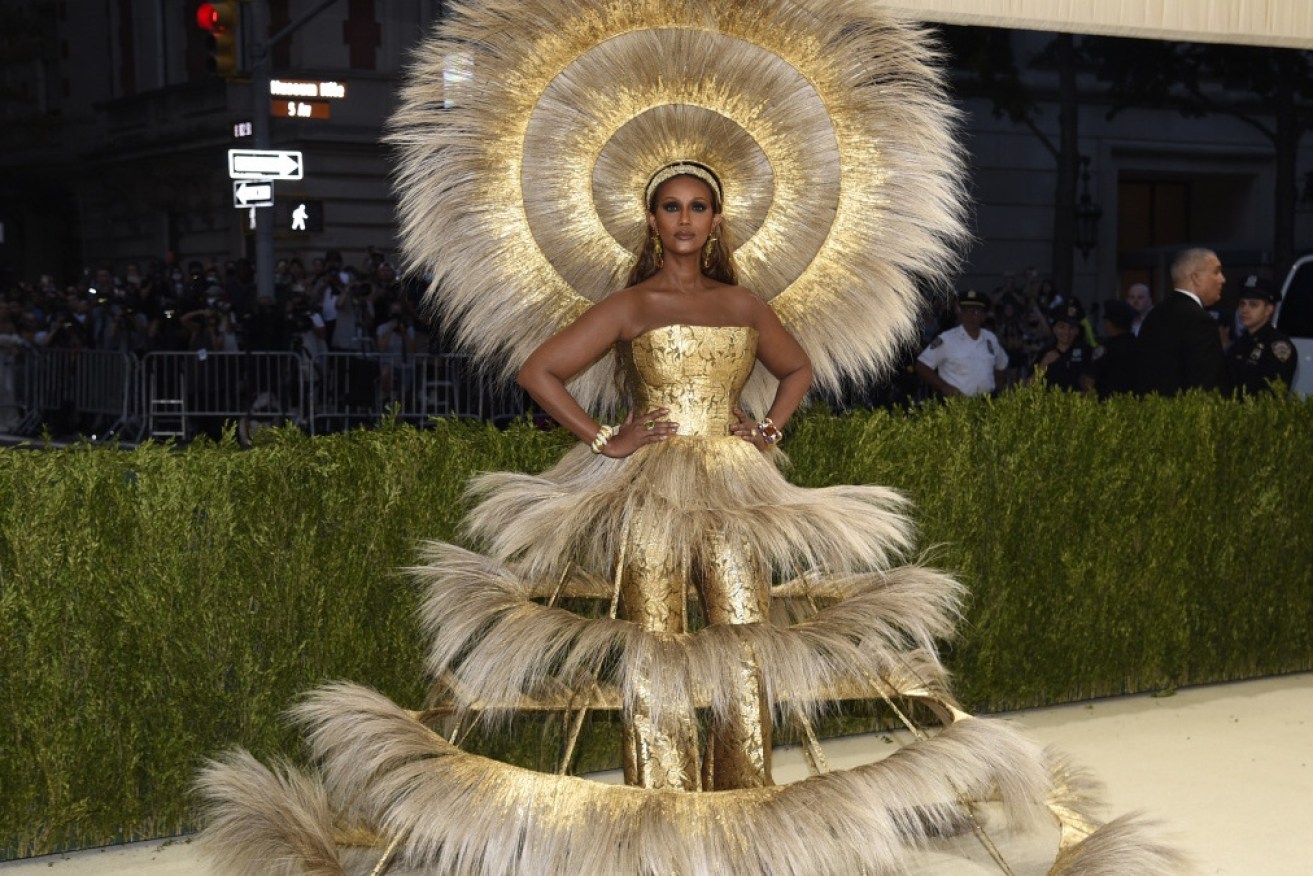 We can be heroes: Supermodel Iman  wears a chandelier gown designed by Harris Reed.