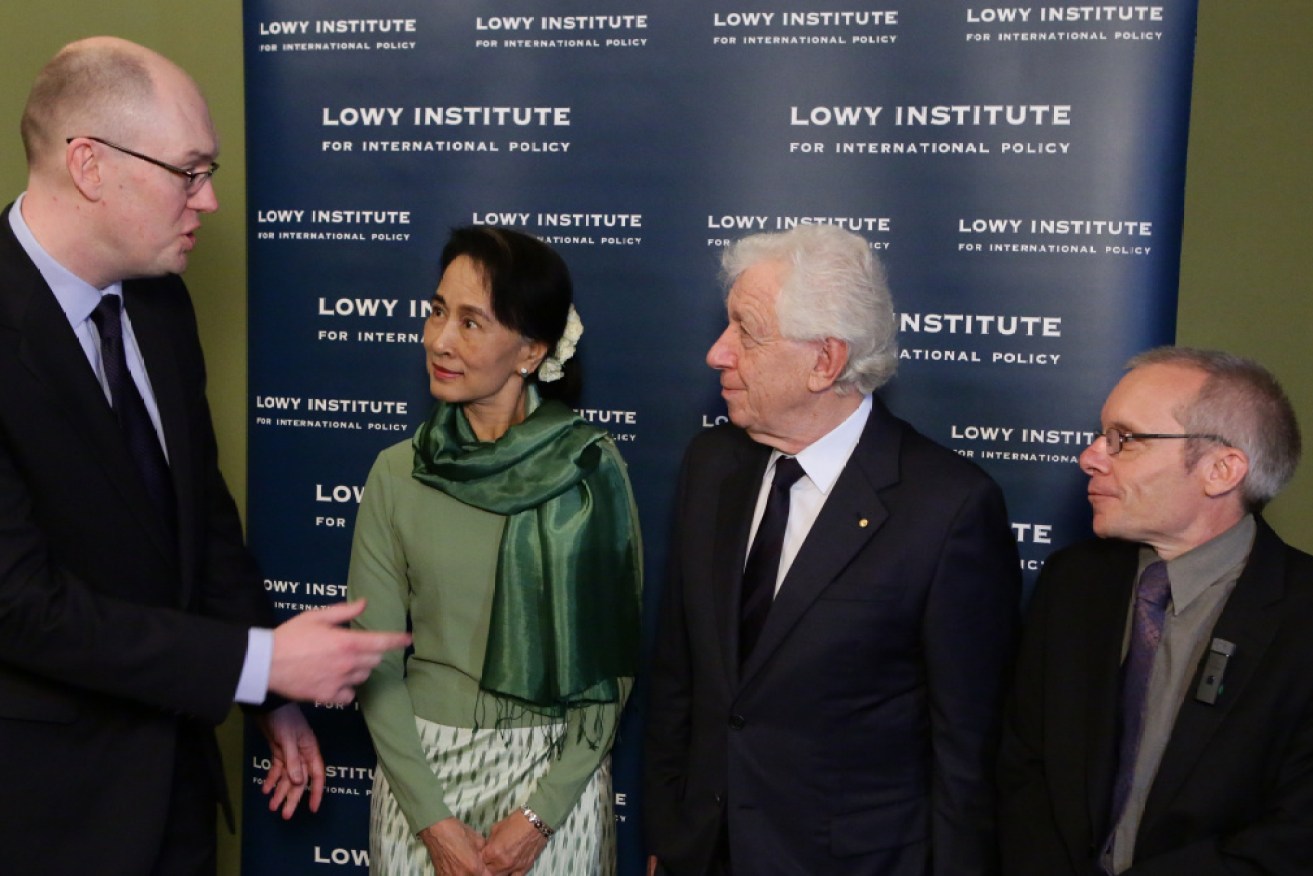 Detained Australian economist Sean Turnell (far right) with toppled Myanmar leader Aung San Suu Kyi not long before the 2021 coup.