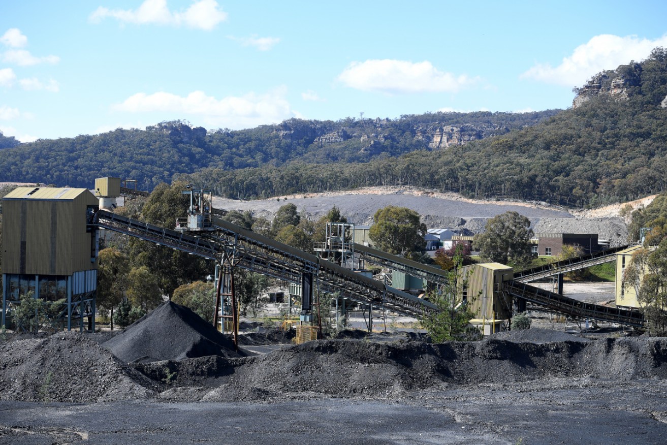 The two men were trapped when a shaft collapsed at the mine, north of Emerald in Queensland.