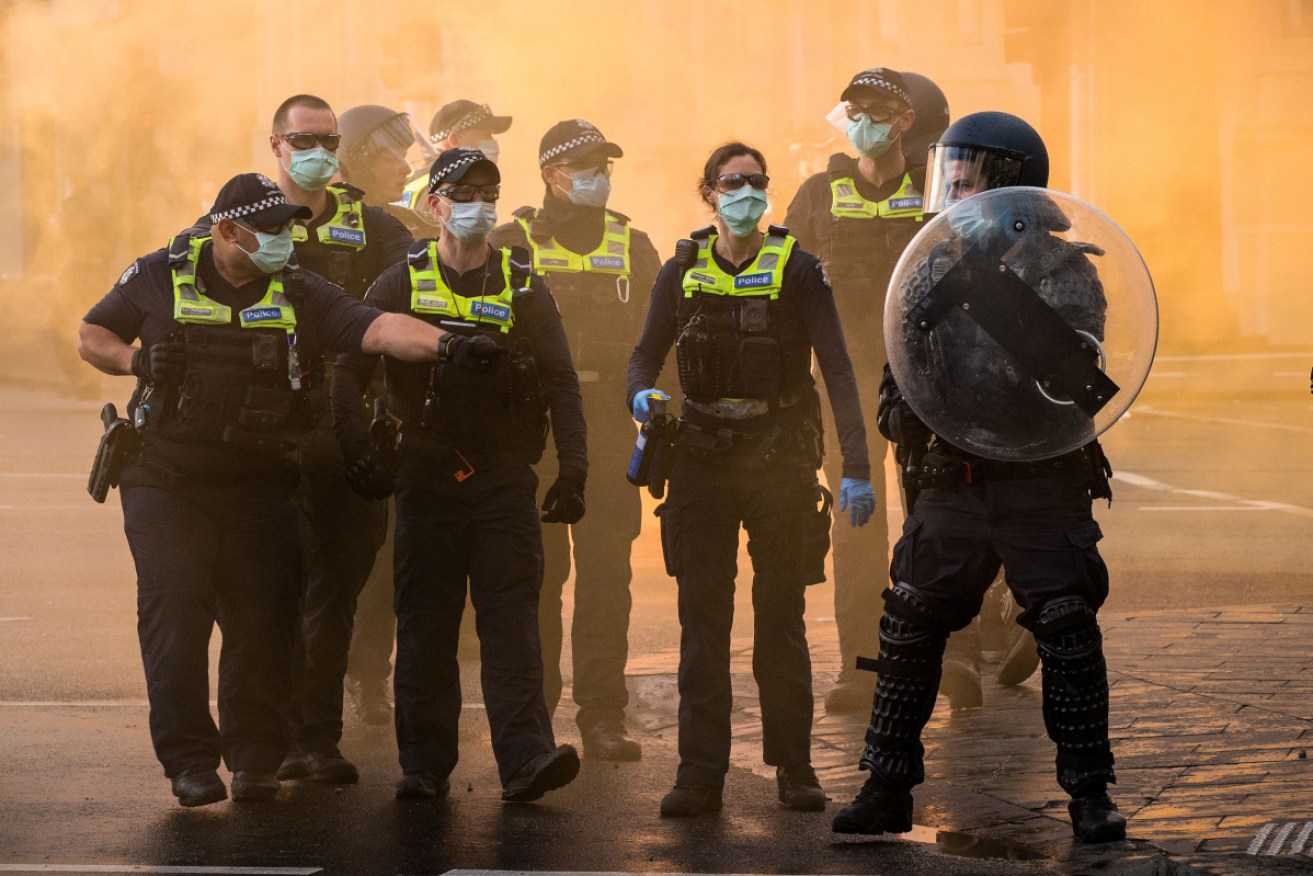 Police confront protesters at Monday's clash outside the construction union's headquarters in Melbourne.