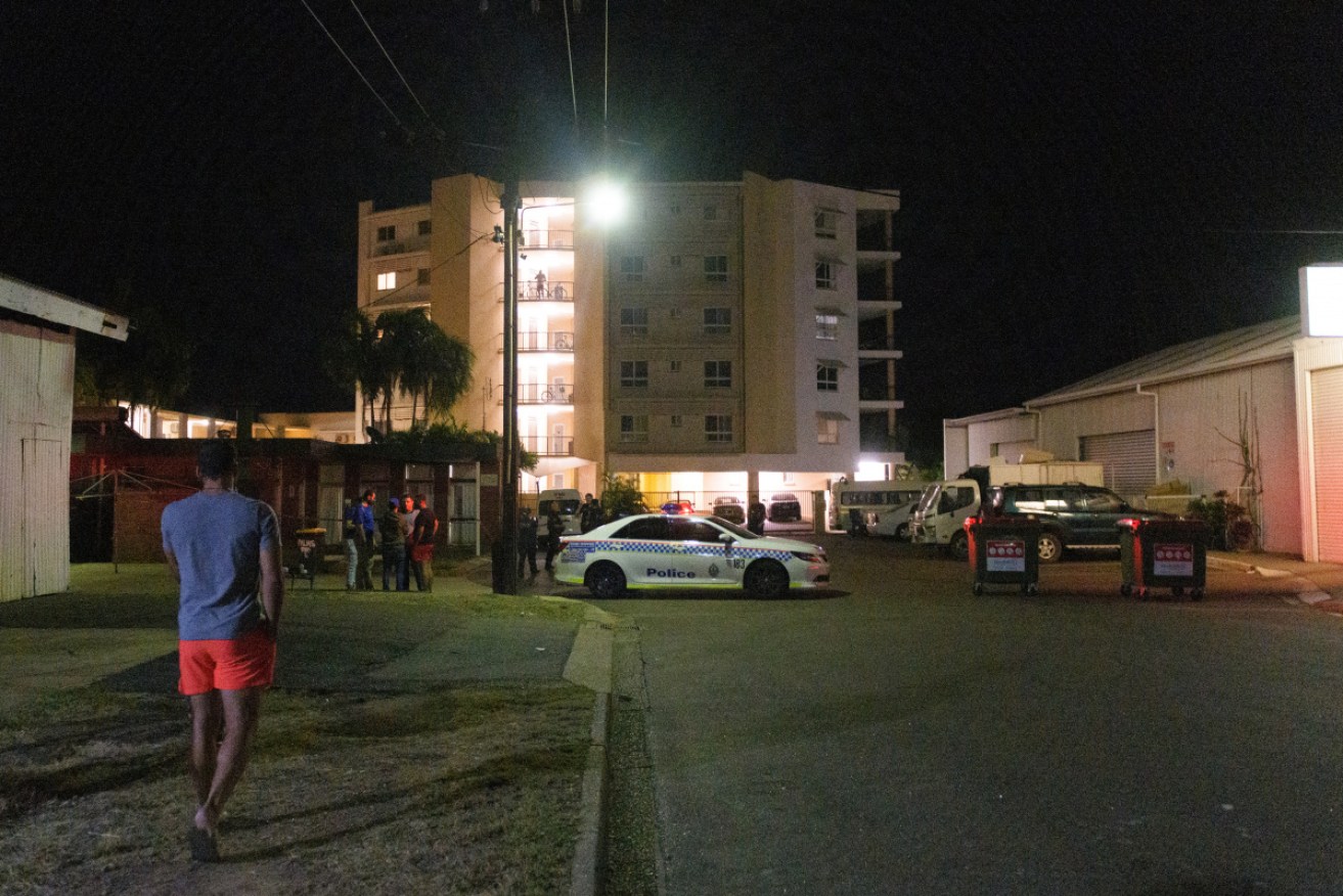 A man has told of his girlfriend's legs being shot as he shielded her in Darwin's Palms Motel. 