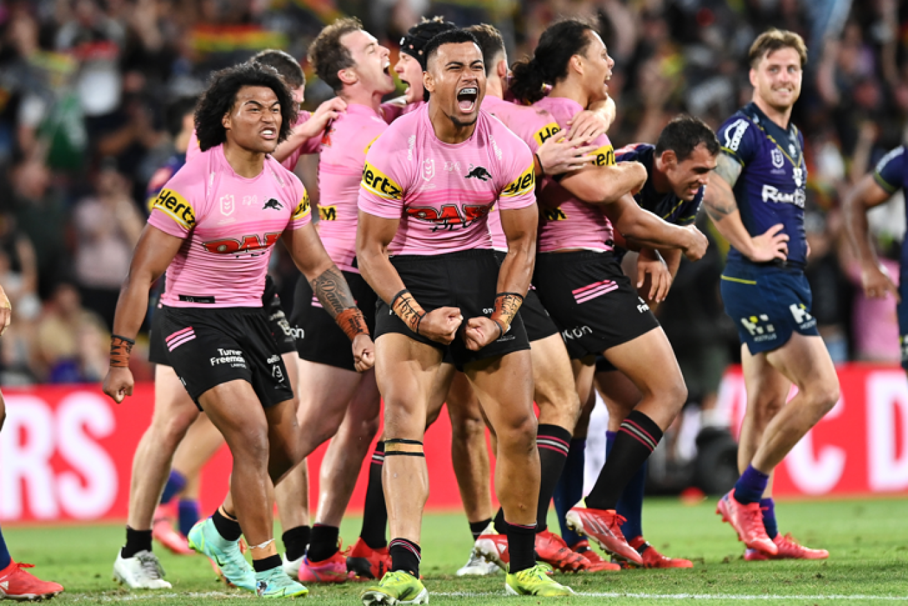 Brian To'o and Stephen Crichton of the Panthers howl in triumph after booting Melbourne from the NRL finals.