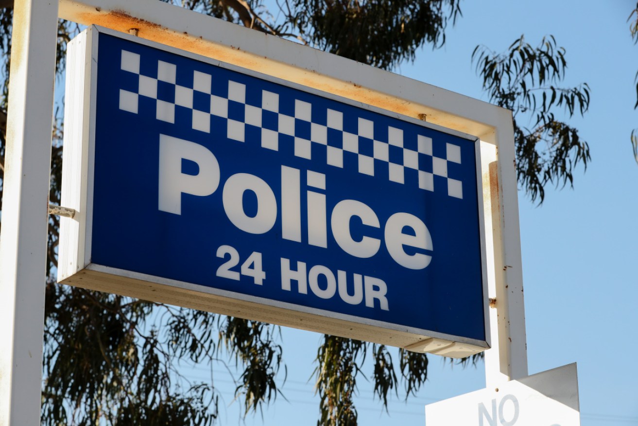 Two Melbourne people allegedly used used fake NT driver's licences to enter WA for the AFL final.