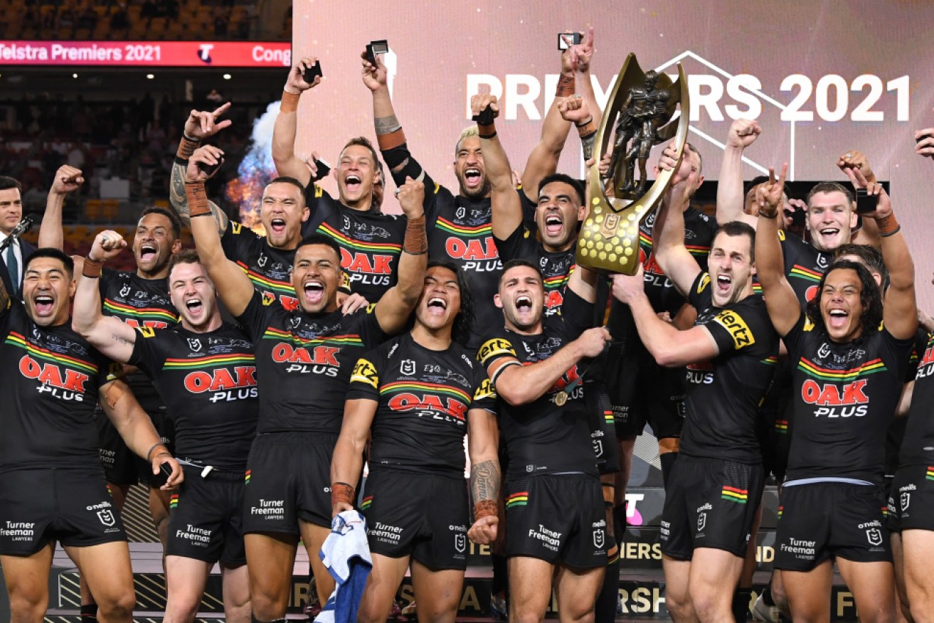 The triumphant Panthers celebrate their win at Suncorp Stadium in Brisbane on Sunday night.