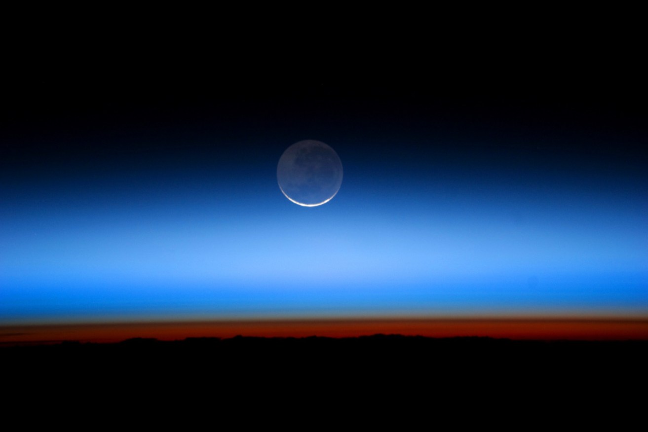An image taken from the International Space Station in 2011 shows Earthshine on the Moon.  