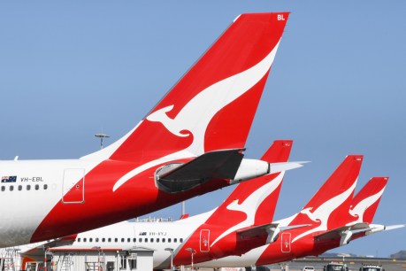 Qantas flags $1.1 billion first-half loss
