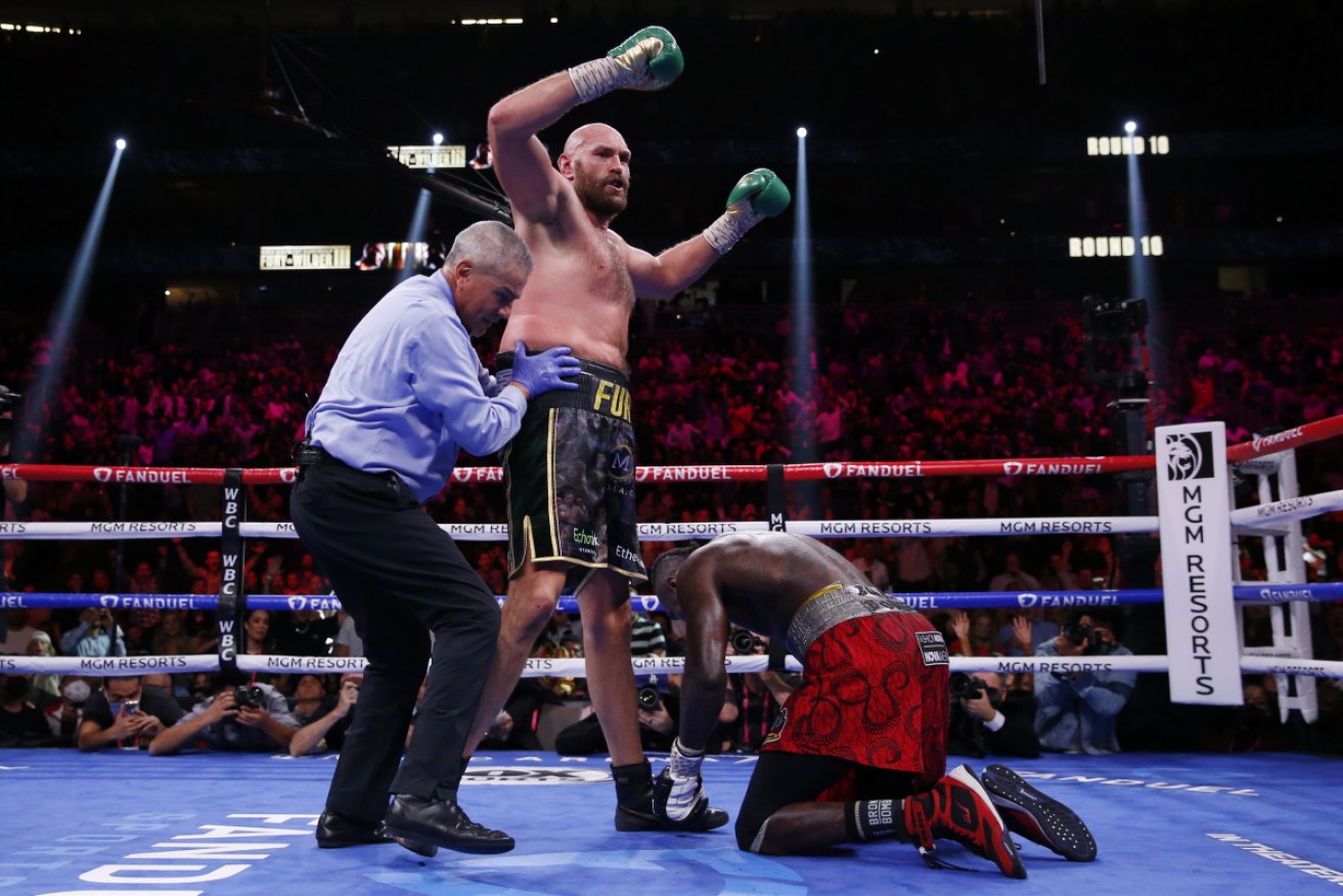 Tyson Fury has stopped Deontay Wilder in the 11th round to retain the WBC heavyweight title.