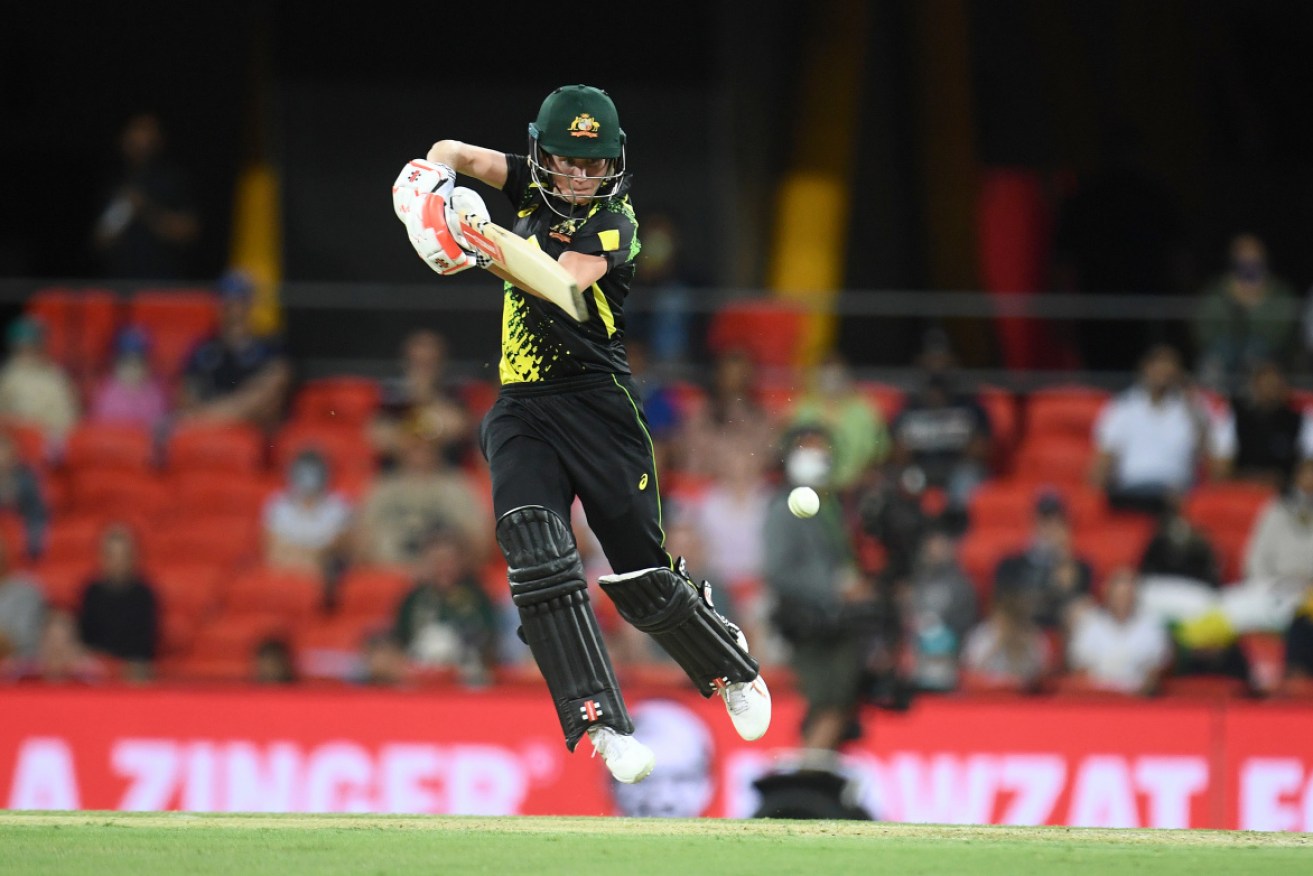 Beth Mooney scored 61 as Australia posted a 14-run win over India in their third Twenty20 match on Sunday.