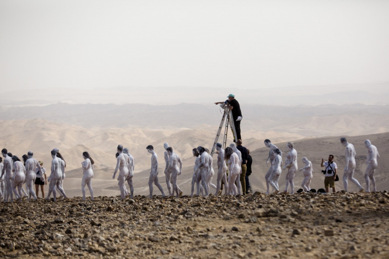 People have taken part in a nude photo shoot to draw attention to a bid to preserve the Dead Sea.