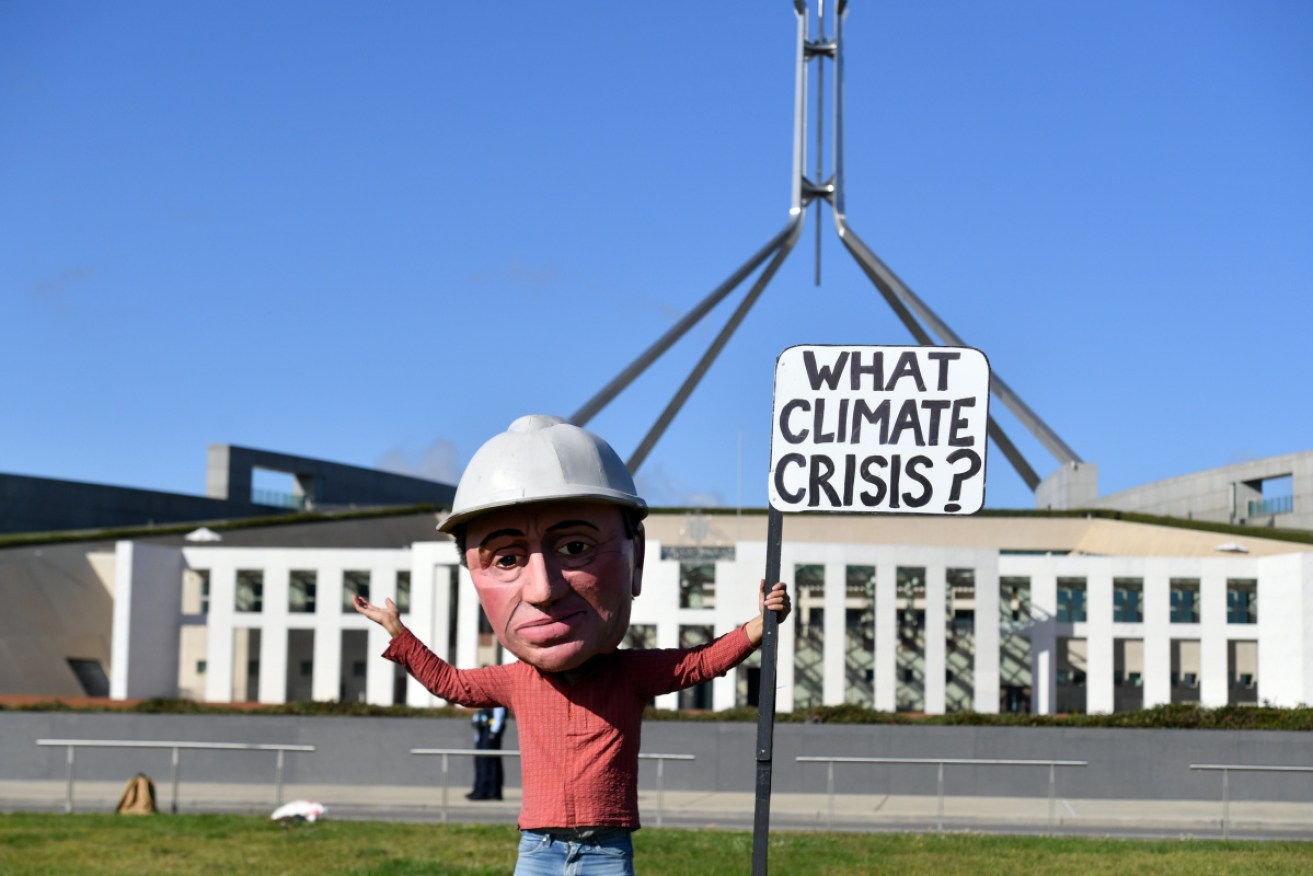 An Extinction Rebellion protester outside Parliament House on Tuesday.