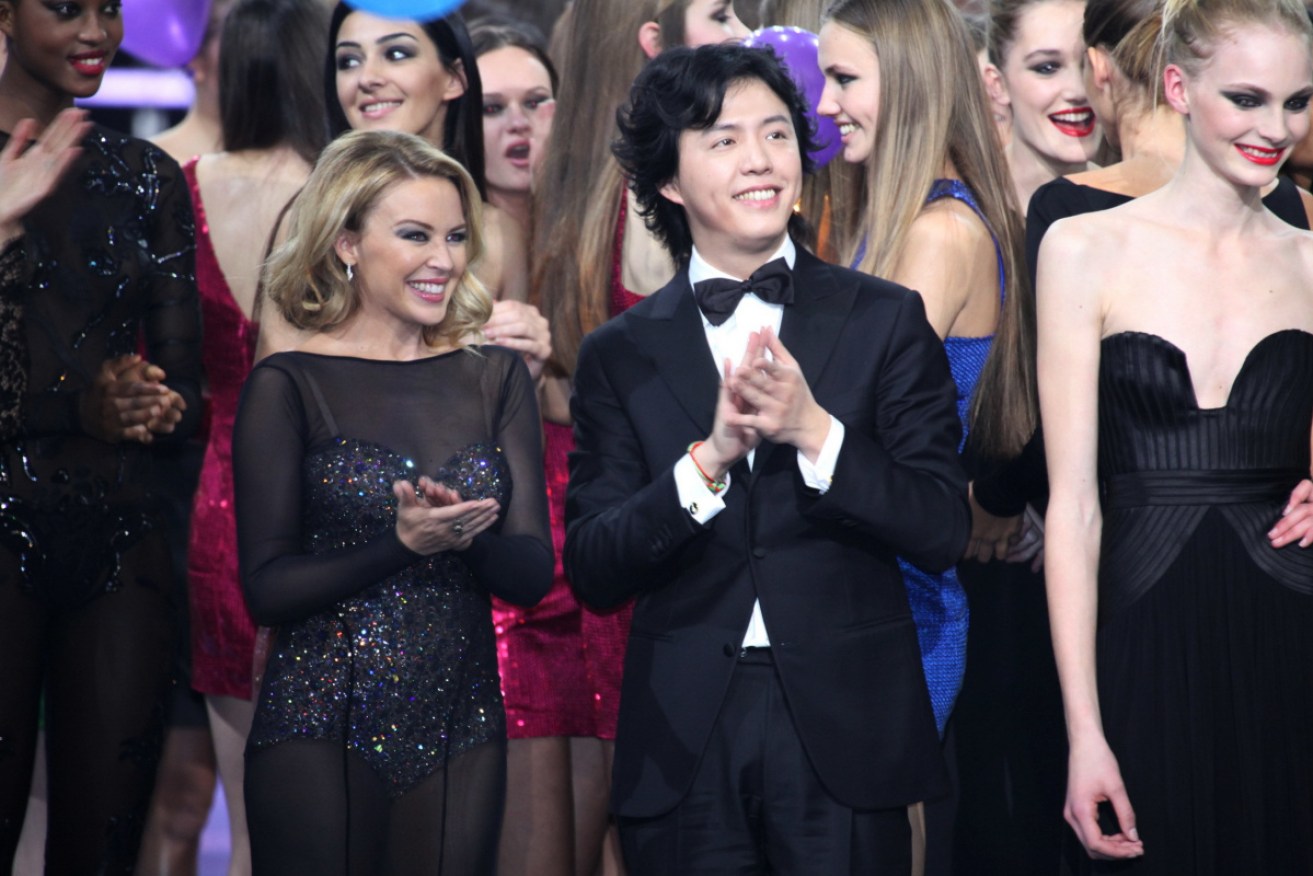 Chinese pianist Li Yundi, front second right, rubbing shoulders with Kylie Minogue and Julia Schneider at the final of the Elite Model Look competition in Shanghai. Photo: AAP
