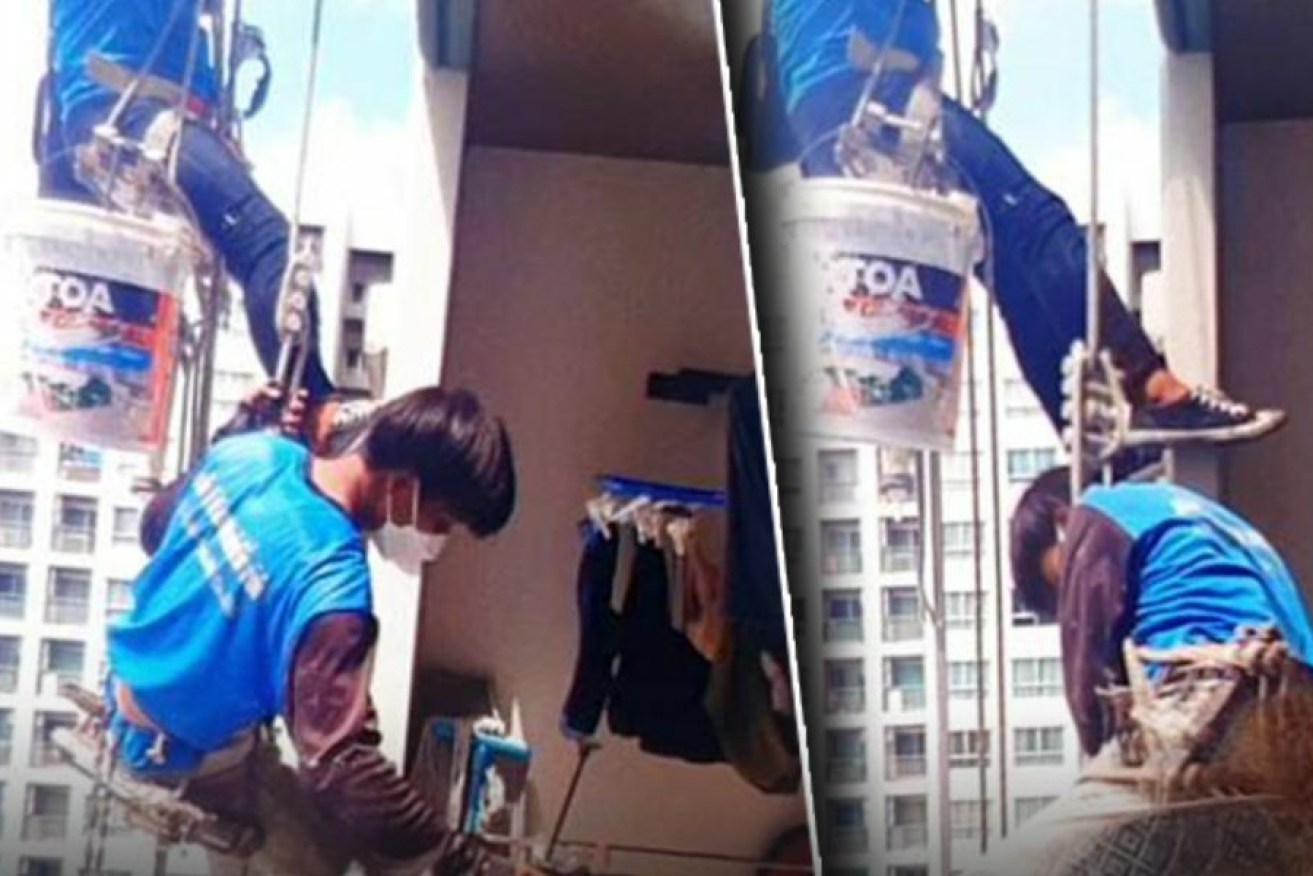 The two painters were left dangling high above the ground until they could be rescued.