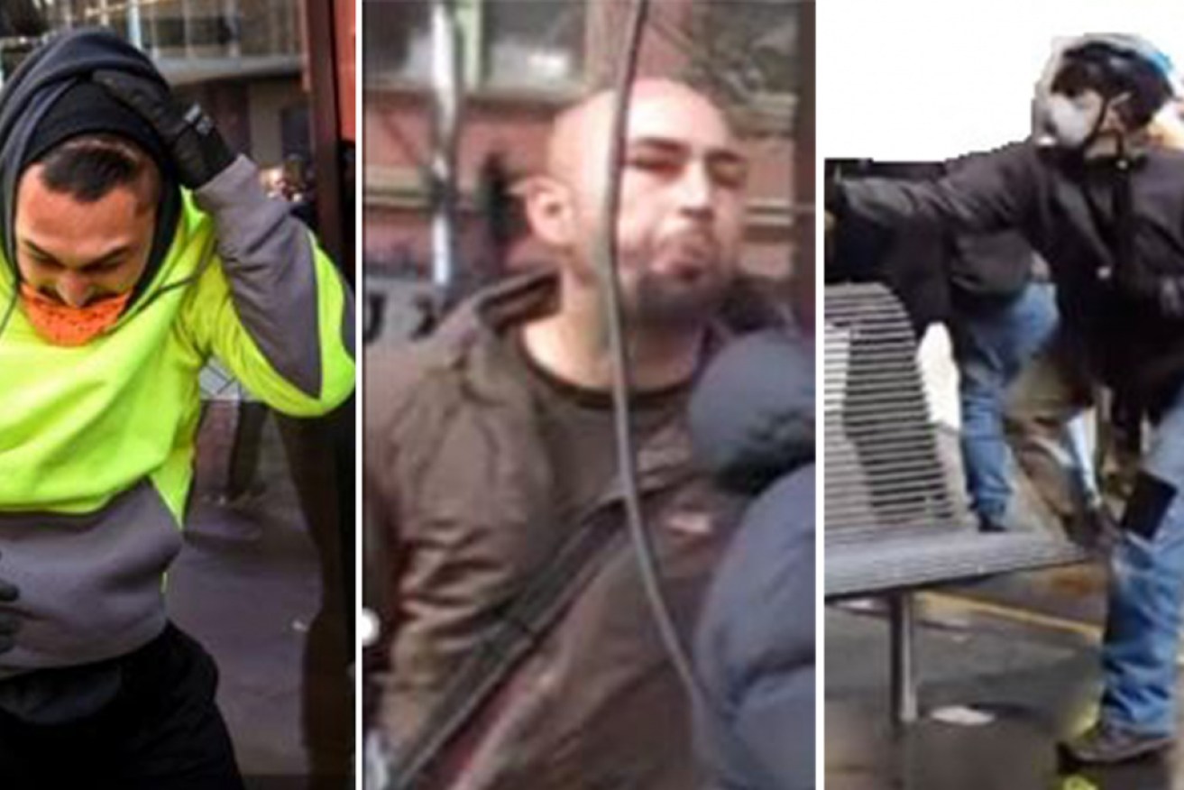 Victoria Police have released photos of men wanted over an attack on journalist Paul Dowsley.