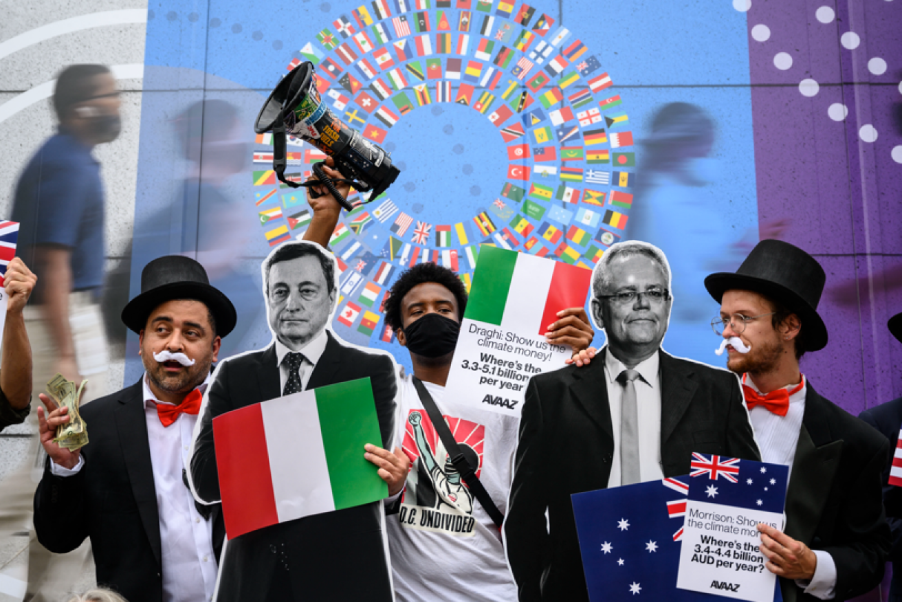 Climate crusaders dressed as debt collectors single out Scott Morrison and Italy's Mario Draghi as two of the world's biggest climate cheapskates.
