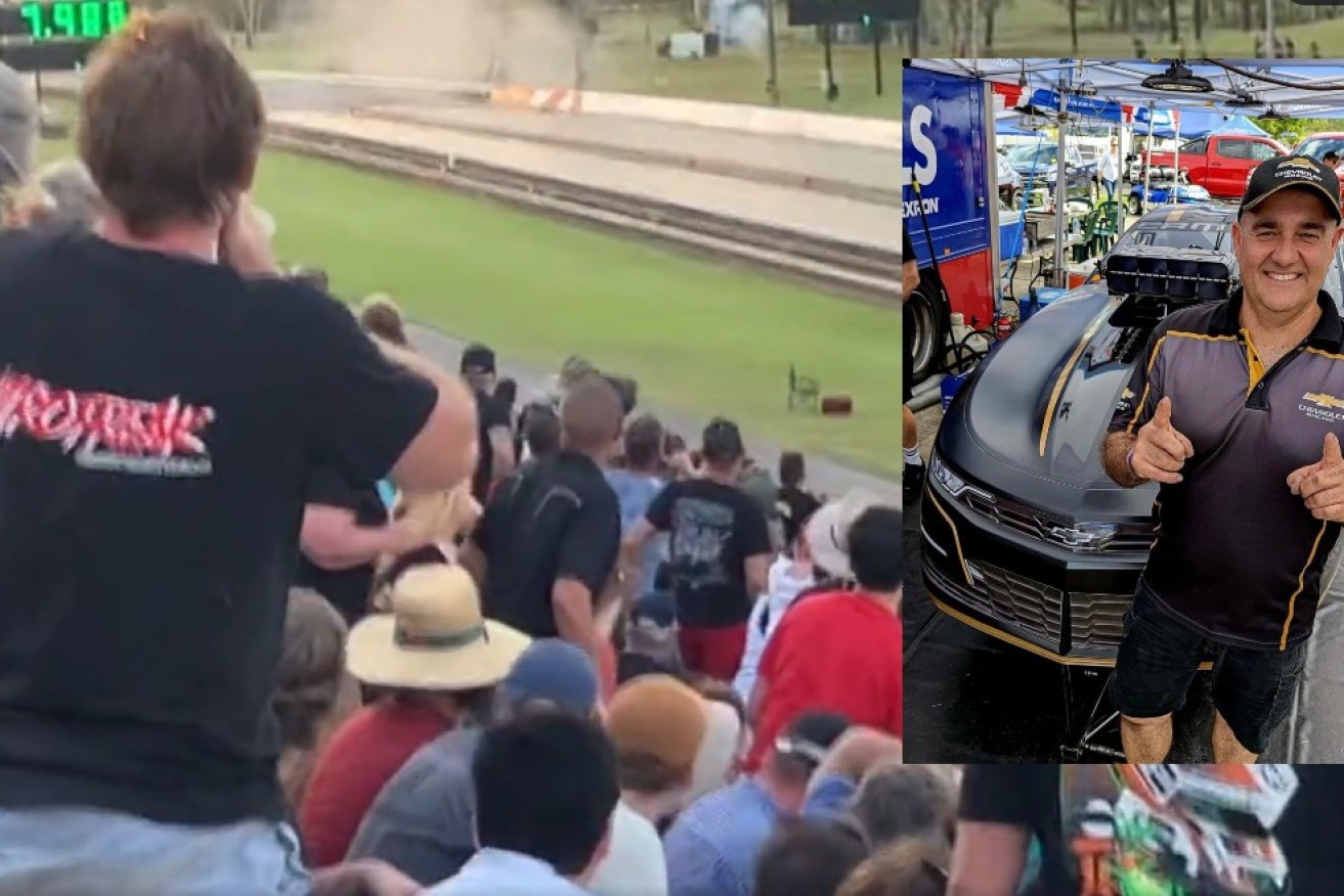 Shocked viewers in the stands watch as Sam Fenech's car slides, flips and rolls.