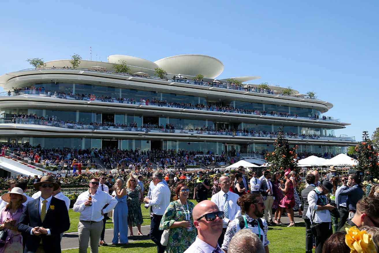 Worker and patron at Melbourne Cup tests positive to COVID-19. 