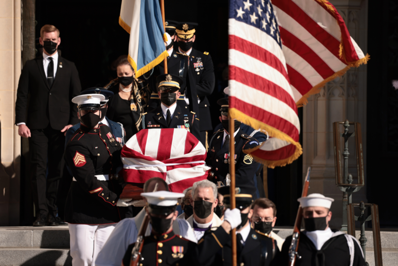 Colin Powell's casket leaves the church after a service that brought together bitter political rivals  in their shared sense of loss.