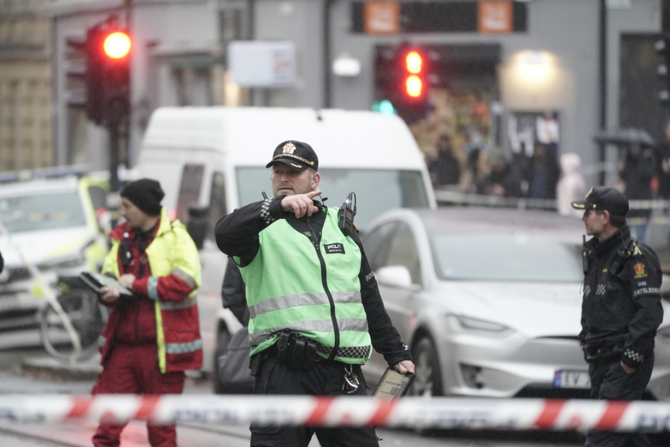 A man with a knife has threatened people on a street in Oslo before being fatally shot by police. 