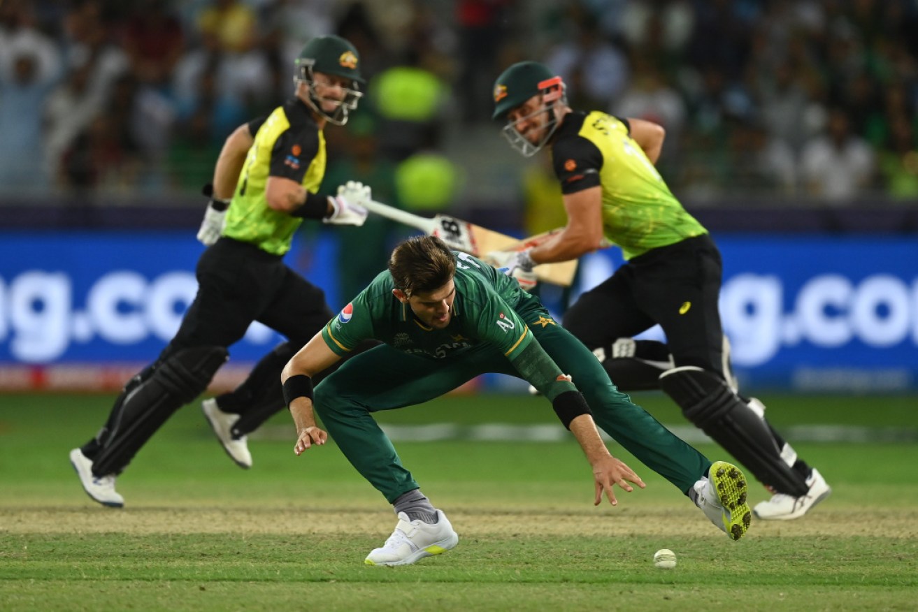 Pakistan's Shaheen Afridi fields the ball as Australia races to a T20 semi-final win.