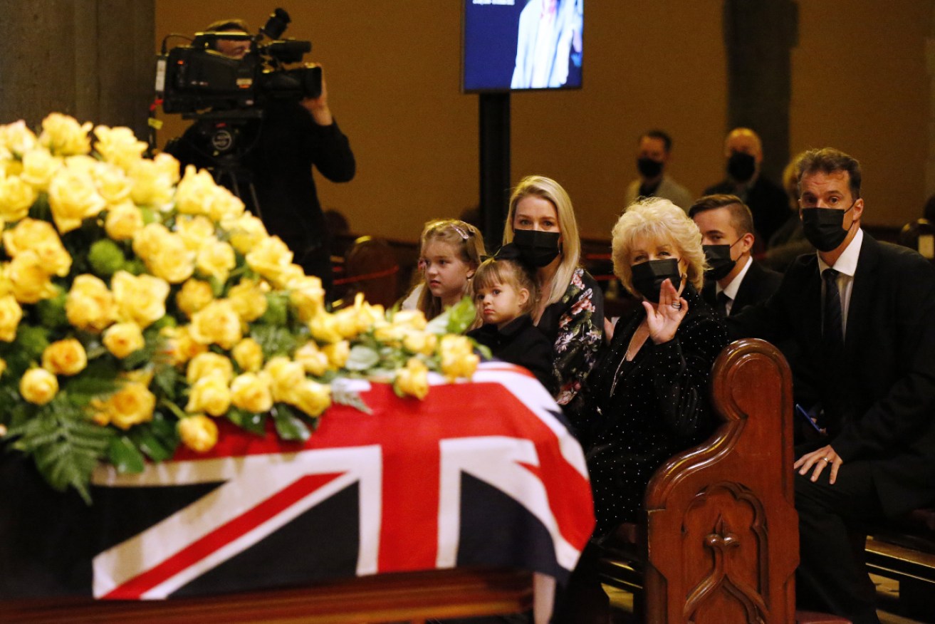 Pattie Newton with daughter Lauren and her children at the funeral on Friday.