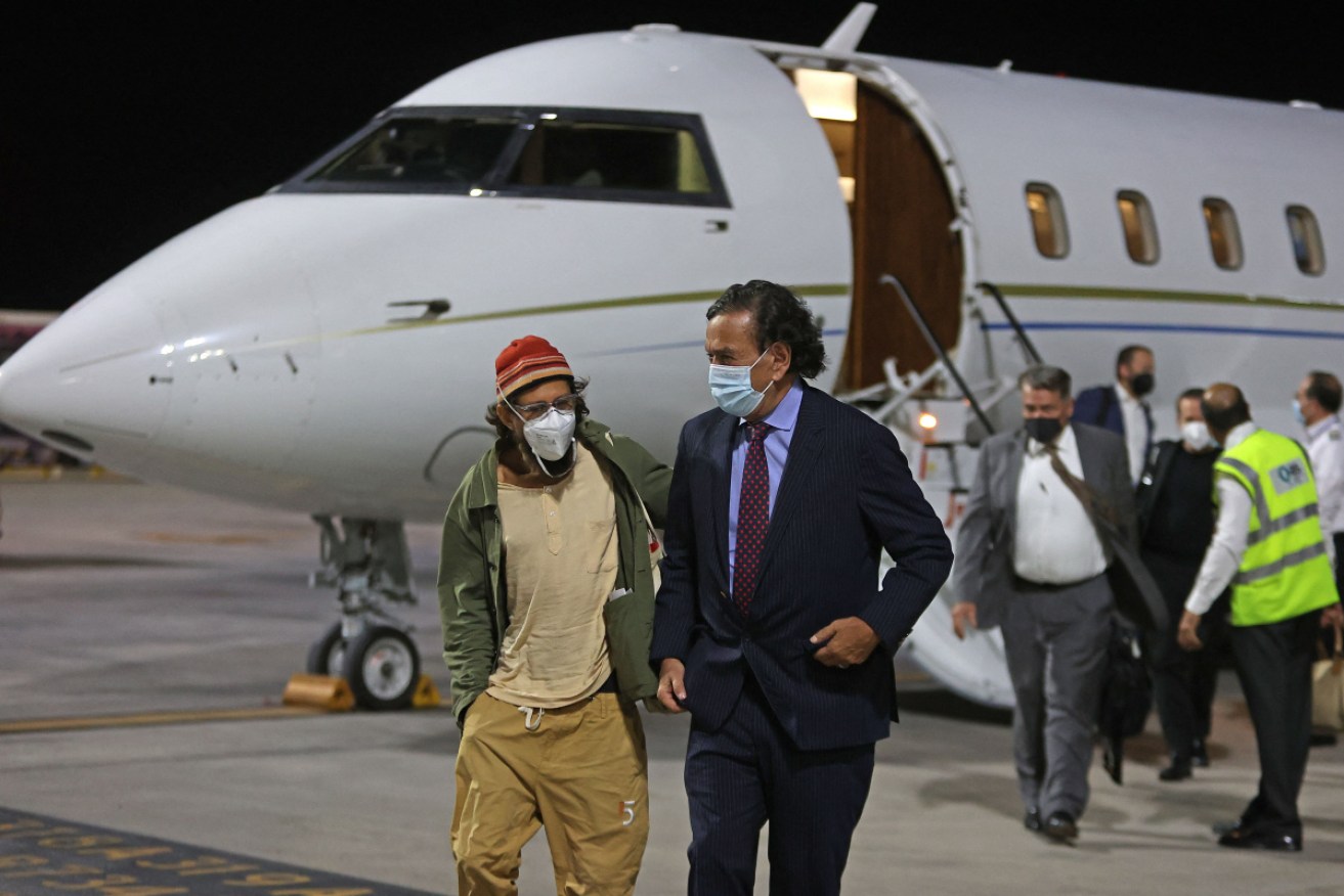 Fenster (left) with former US diplomat Bill Richardson after arriving in Doha.