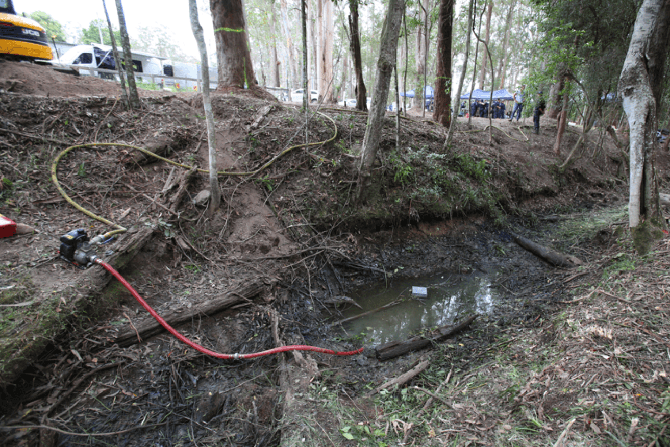 The drained creek bed where police found several cloth items now undergoing forensic analysis.