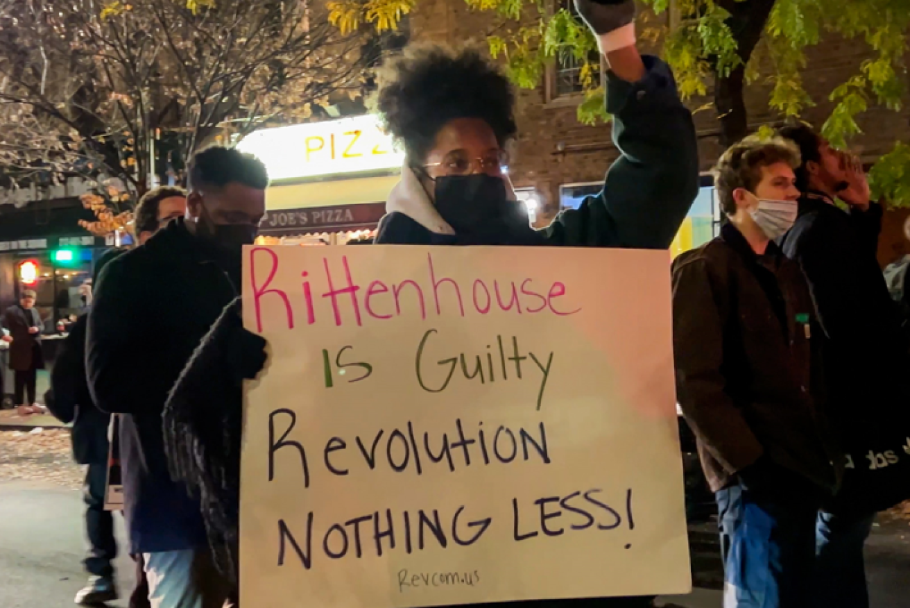A protester demands reform at a post-verdict demonstration in New York's Greenwich Village - one of scores of protests across the country.