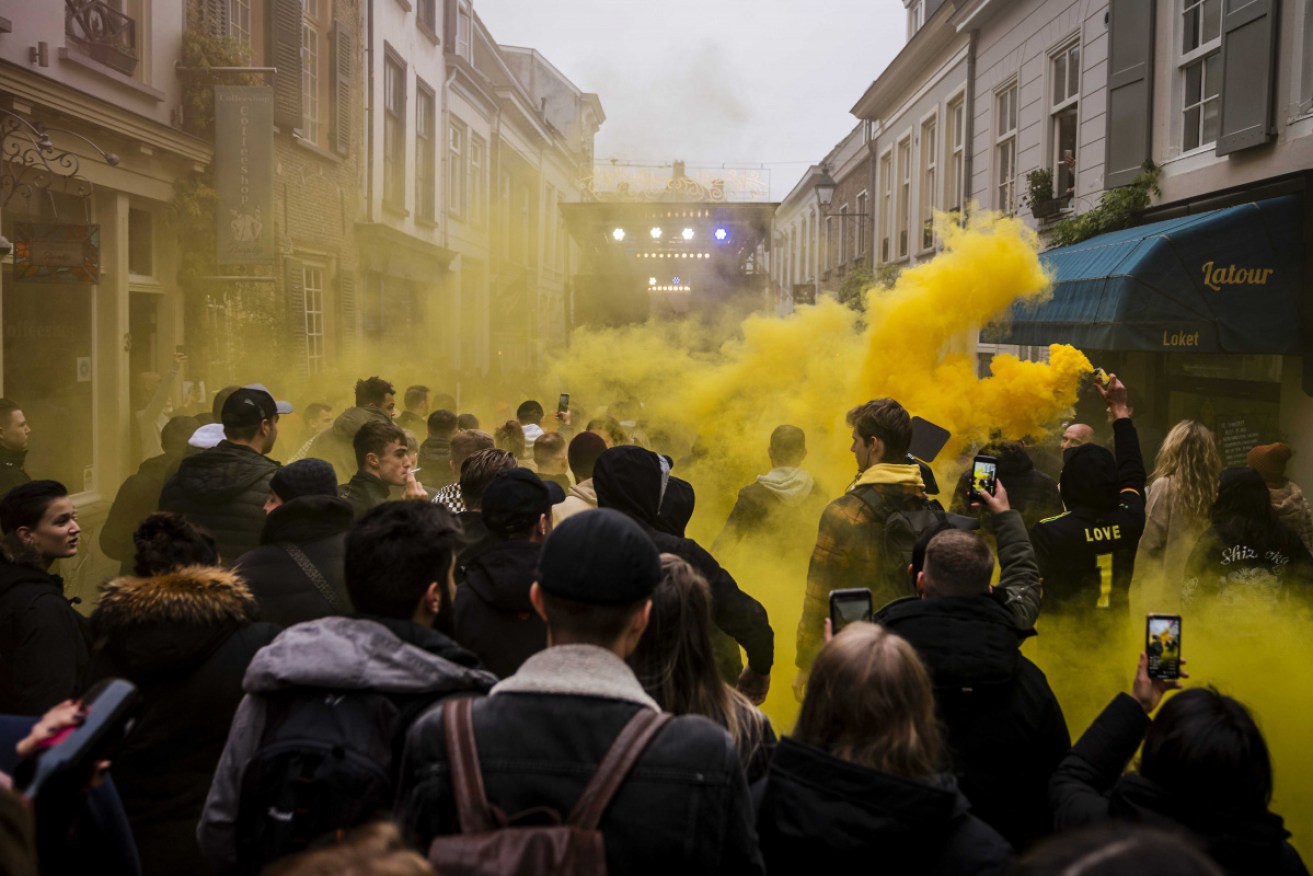 At least 28 people were detained and five police officers hurt in further unrest in the Netherlands.