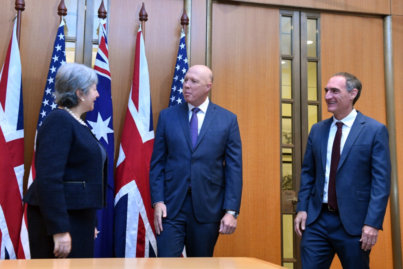 Peter Dutton was joined by Victoria Treadell and Michael Goldman to sign an AUKUS agreement.