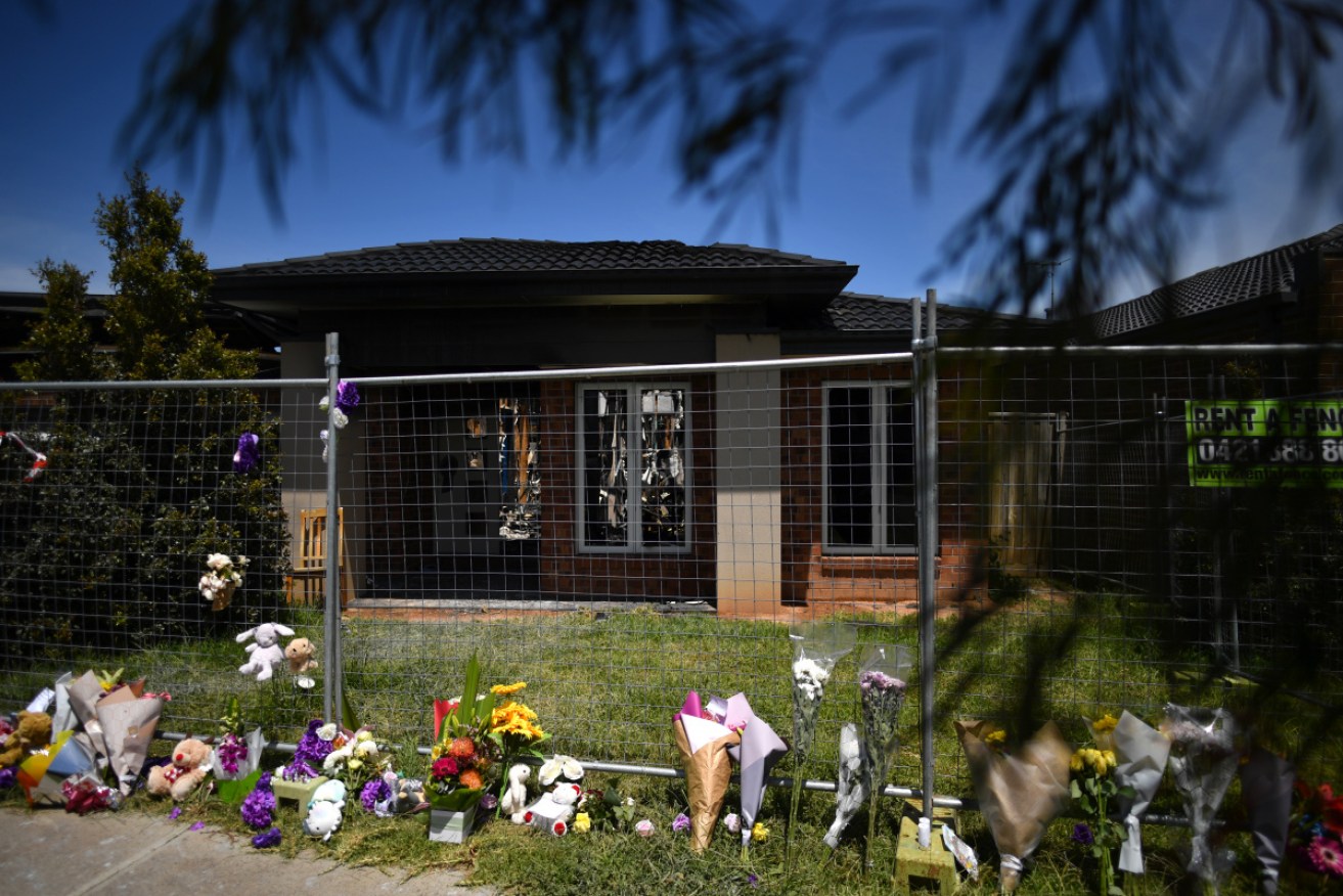 Floral tributes outside the house were four children died in a fire on Sunday.