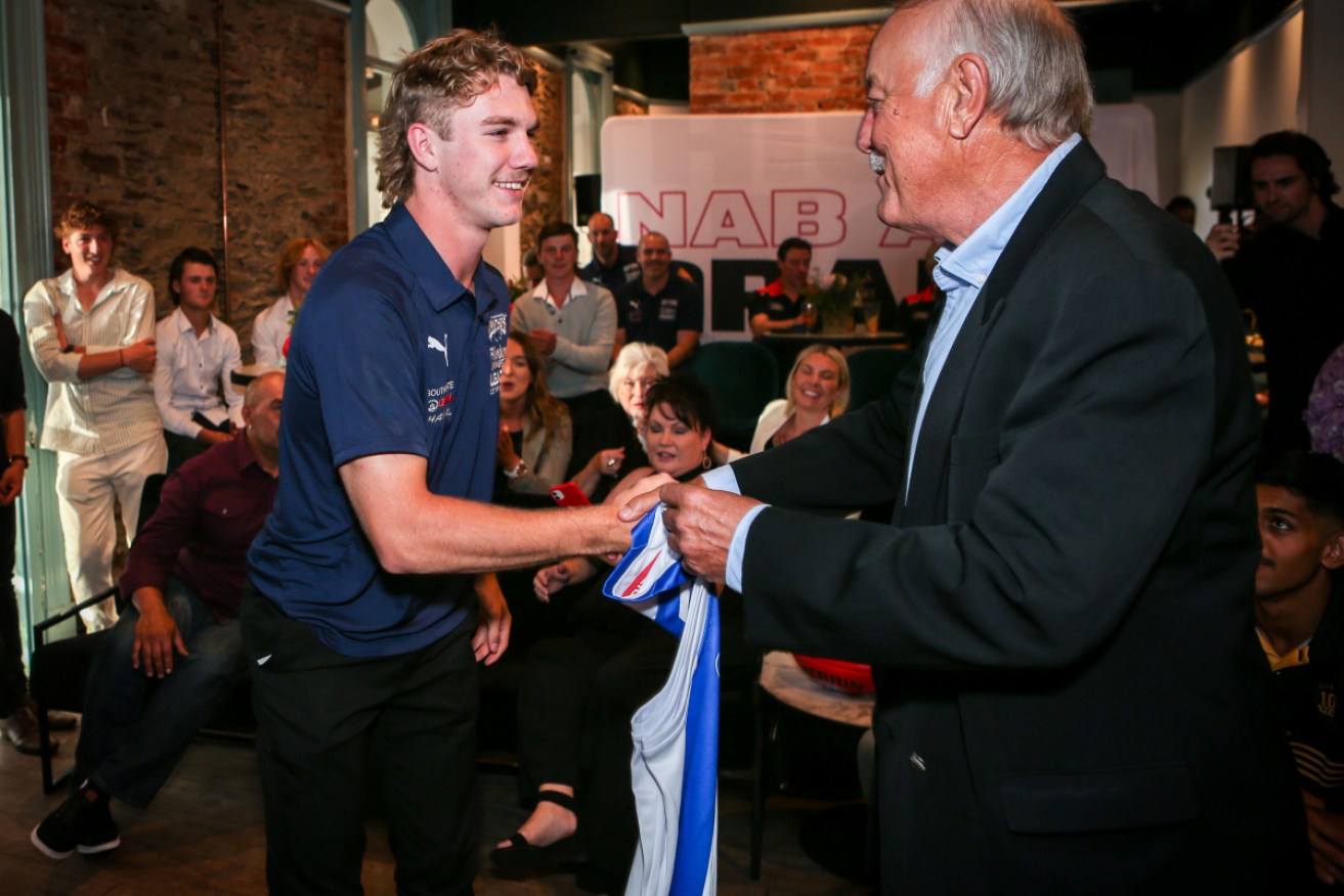 No.1 draft pick Jason Horne-Francis was presented with his North Melbourne jumper by Malcolm Blight.