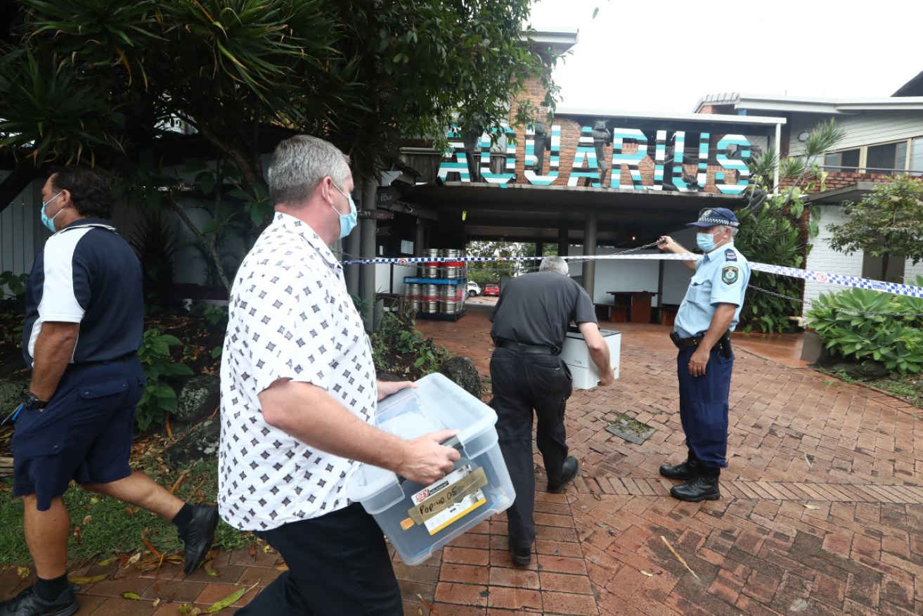 Supplies are brought into the Aquarius Backpackers, where more than 80 people are in lockdown.