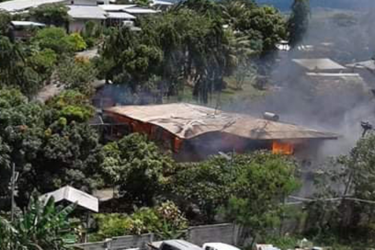 A building in Mr Sogavare's private compound was set alight, apparently by looters, on Friday. 