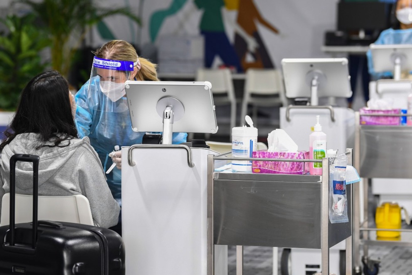 COVID testing has ramped up at Sydney airport after the Omicron variant was detected in two passengers.